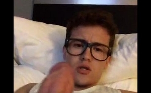 Twink with glasses jerks his cock