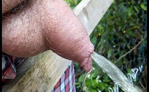Soft uncut cock pissing out of pocket close round
