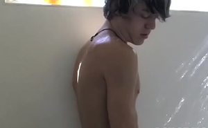 Cute twink Tristan Tyler masturbates solo while showering