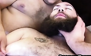 Big beard otter blowing cock during bear threesome